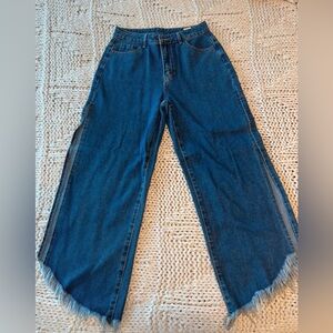 New flared jeans with side slits . Size L , never worn